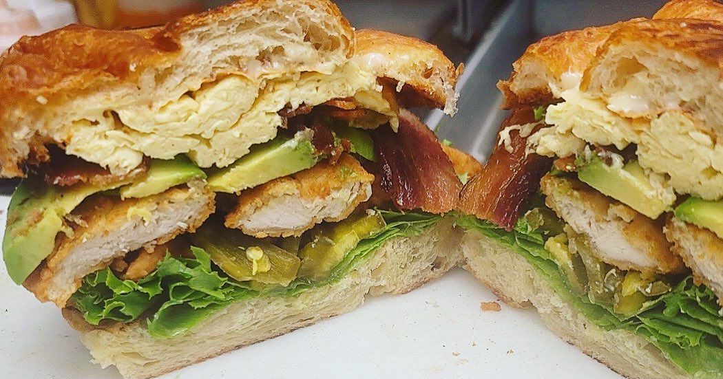 Check out this masterpiece that a customer designed! The King Sandwich 👑 which is chicken tenders with lettuce, melted pepperjack cheese, jalapenos and buffalo ranch sauce switched to a croissant with 2 scrambled eggs, avocado and bacon added!  Breakfast and lunch combined - happy Friday! 🍳🥓🥐🥑